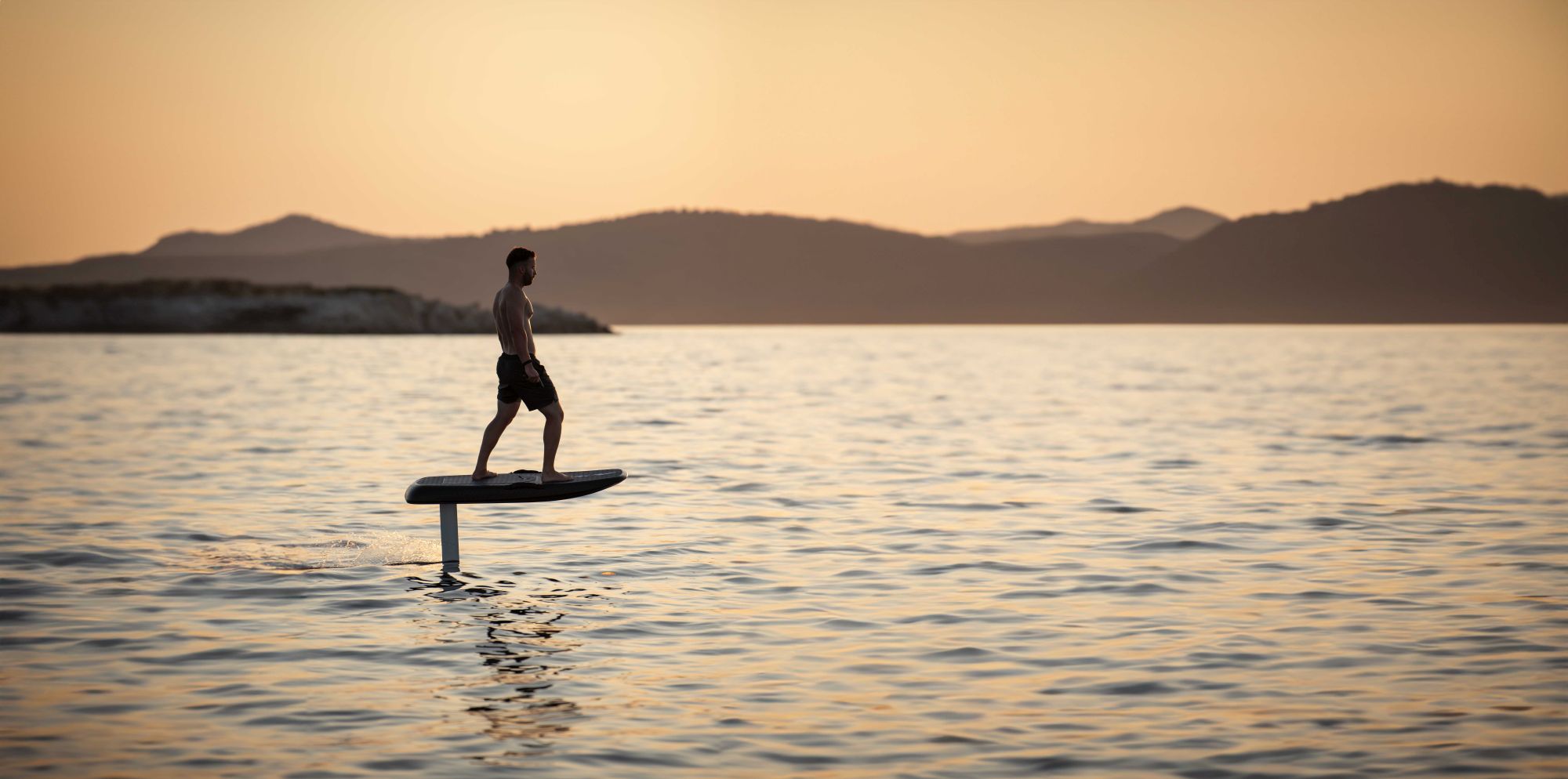 Rider walking on water on an eFoil